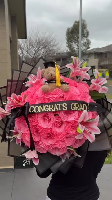 Pink rose graduation bouquet with teddy bear